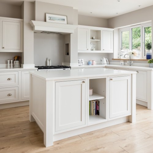 Off-white shaker-style kitchen with an island, open shelves and a range cooker